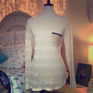 Cream top with fun pocket